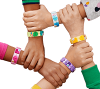 Crossed arms with lego bracelets